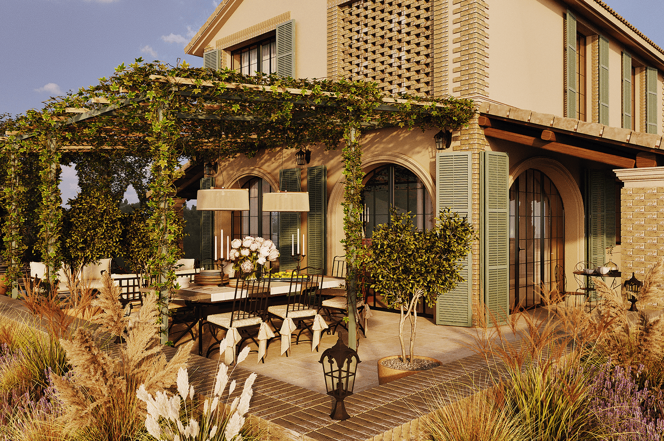 Outdoor dining area with a table set under a pergola covered in greenery beside a house with arched windows and green shutters.