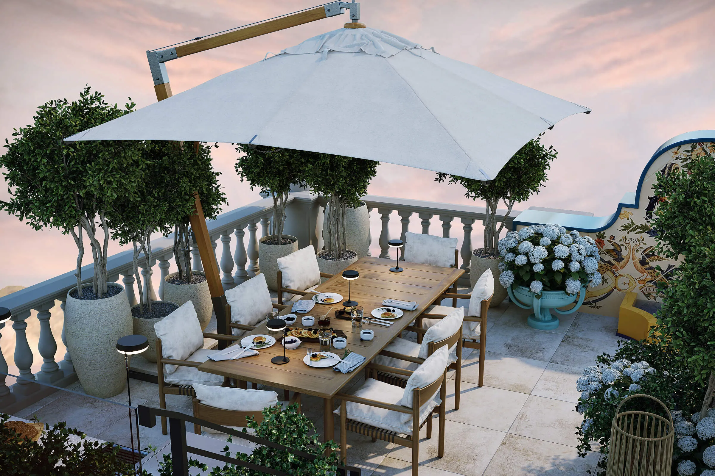 Outdoor dining area with wooden table, cushioned chairs, large white umbrella, potted plants, and set table with plates and lights.